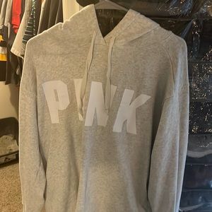 This is a pink Victoria’s Secret sweater, gray and white only worn once.